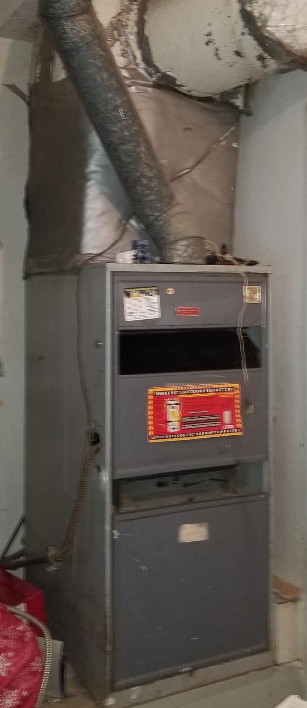 Before a completed furnace replacement service project in the  area